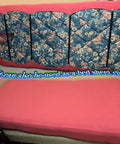 Premium Adjustable Elastic Strap Holders For Recliner Sofa Couch And Loveseat Slipcovers keep cushion covers secure on pink bed with floral mattress.