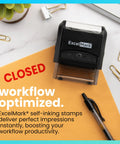Heavy Duty Self Inking Rubber Office Stamp Printing Crisp Closed Messages In Bold Red Ink With A Quick Swap Replaceable Pad on orange paper.