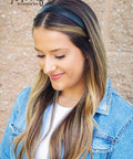 One Inch Vegan Leather Headband For Women Non Slip Hair Band Black worn by a woman with long hair and denim jacket.
