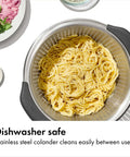 Non Slip Grip 5 Qt Stainless Steel Colander with Comfortable Handles, filled with pasta, showing durable nesting strainer for rinsing.