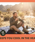 Man sitting on Extra Large Merino Wool Camp Blanket for Outdoorsy Trips, Breathable and Temperature Regulating, Durable Wool Throw Bedroll.