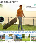 Man carrying wheeled bag with 10x10 Pop Up Canopy Tent With Side Walls Waterproof Portable Shade for camping and events.