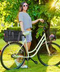 Rear Bike Basket With Removable Insulated Liner Ride Ready Rainproof Cover Cargo Net Quick Release on woman's bicycle in park.