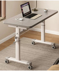 Hella Smooth Height Adjustable Standing Desk With Spacious Bedside Table For Cozy Home Office Setup Featuring Effortless Lift Grey Matte Finish 120cm Wide Straight Up Grind Upgrade with laptop and coffee cup.