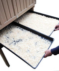 Hands pulling out litter trays from Snap Lock Large Chicken Coop for Backyards, spacious hen house with removable dividers.