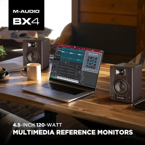 Zero Latency Wired 4.5 Inch Studio Monitors And PC Speakers on a desk beside a laptop with music production software.