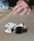 Rugged Swivel Furniture Casters With Gliding Silent Rollers And Tough Round Plates Built For Cabinets Drawers And Office Gear On Hardwood Floors Featuring Quick Fit Brake Clamps For Any Space mounted on a wood surface.