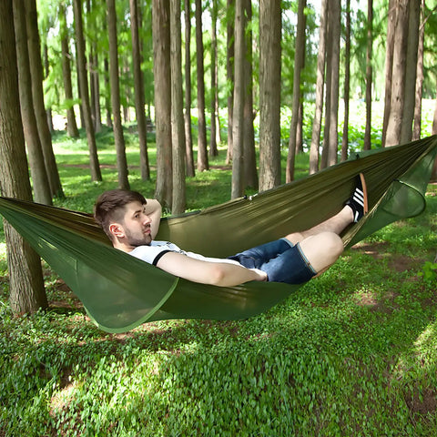 Outdoor Camping Hammock With Mosquito Net And Bug Net Dope 13 Foot Parachute Nylon Hammock With Tree Straps And Carabiners in use