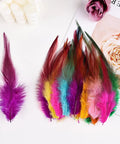 120 Pcs 5 To 7 Inch Rooster Saddle Feathers Bulk For Crafts And DIY Projects, colorful mix of natural hackle feathers on display.