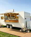 Built Different 18 Foot White Prefab Food Trailer For Catering Hustles Featuring service windows and wooden accents.