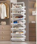 Slick Pull Out Shoe Rack With Heavy Duty Smooth Slide Rails And Adjustable Height Vertical Design displaying a variety of shoes in a white finish.