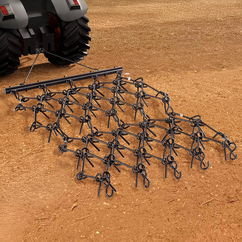 Heavy-Duty Chain Harrow with 69 Teeth attached to ATV. Drag Harrow For Tractor ATV And UTV Use Heavy Duty Chain Harrow With 69 Teeth 4 Ft By 4 Ft A True Workhorse For Soil Prep Seeding Lawn Smoothing Landscaping And Gravel Driveway Maintenance.