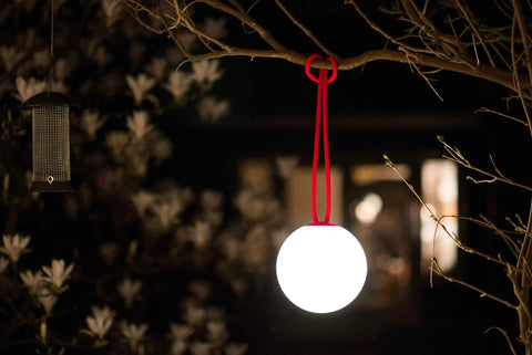 Bolleke Hanging Lamp 2 Pack Dark Ocean LED Orb Pendant Lighting for indoor spaces hanging on a tree branch, illuminating surrounding area