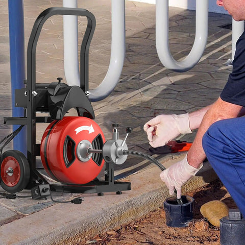 Heavy Duty Electric Sewer Auger Tough As Nails Walk Along Drain Cleaner with auto feed cable in use on clogged drain.