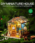 DIY Miniature Greenhouse Kit With Dope LED Lights 1 To 24 Scale Wooden Dollhouse With Realistic Furniture Gift For Adults Cathy's Greenhouse Edition Cozy Home Craft Project showcasing illuminated glass structure in forest setting.