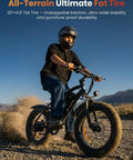 Powerful 1000W Fat Tire Electric Bike For Adults And Teens, 20 MPH Top Speed, 20x4 Fat Tires, Removable 10.4Ah Battery, USB Charging Port, 7-Speed Mountain And Commuter Ebike, Four Bikes In One For City, Trail, Snow And More. Rider on 20x4 all-terrain fat tire ebike on rocky trail
