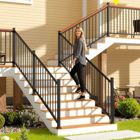 Woman walking on stairs with 2x2x39 Inch Modular Aluminum Deck Post Weather Ready Built Tough With 6063 Aluminum And AAMA 2604 Textured Black Finish