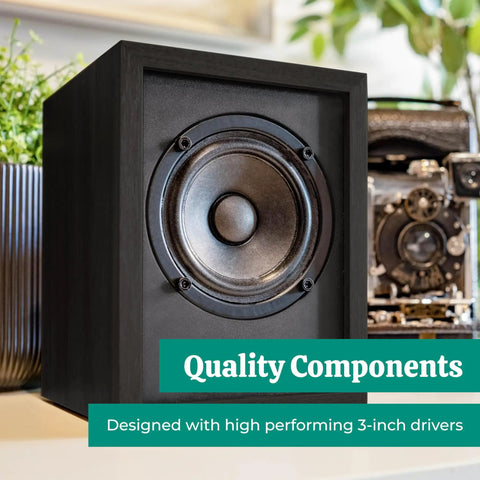 Black wood powered bookshelf speaker with built-in amplifier and 3-inch drivers for turntables, TV, PC, and wireless streaming.