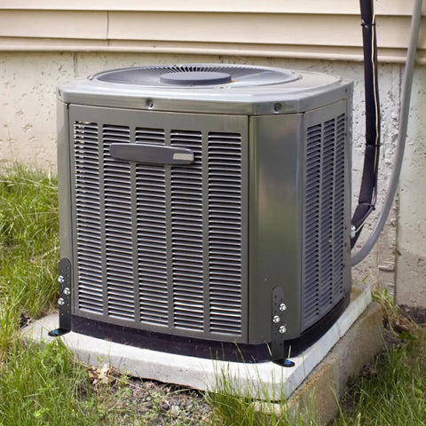 Outdoor AC unit secured with 4 Pack 5 Inch Hurricane Condenser Brackets With Screws Heavy Duty Universal Tie Down Kit L Shape