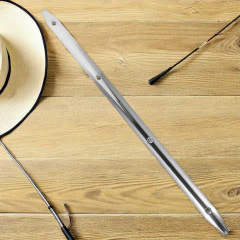 Heavy Duty Stainless Steel Rub Rail For Yacht Hull Protection And Dock Edge Guard on wooden table with hat and fishing rod.