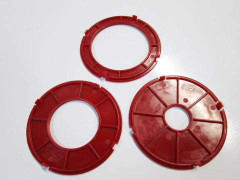 Precision Router Table Insert Ring Set Featuring Workhorse Grade 97 Millimeter Diameter Heavy Duty Aluminum Replacement Plate Quick Snap Install For Weekend Warrior Woodworking Builds, three red rings.