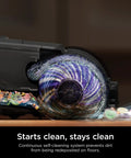 HydroVac Antimicrobial Brushroll And Two Pack Filter Bundle No Fuss For All HydroVac Three In One Multi Surface Cleaners Built For Sealed Hard Floors And Area Rugs Purple White showing self-cleaning brushroll in action