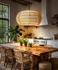 Big Time Upgrade 19 Inch Boho Rattan Chandelier Featuring Five Warm Lights For Farmhouse Dining Rooms, hanging above a rustic wooden dining table.