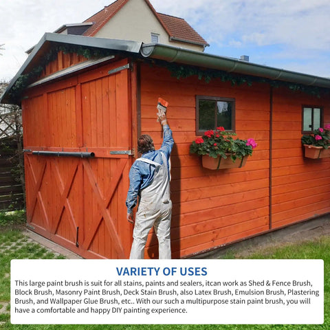Person using a 5 Inch Deck Stain And Sealer Block Brush For Wood And Masonry on a wooden shed wall.