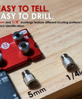 Hassle Free Cabinet Shelf Pin Jig Flips Between 5Mm And Quarter Inch Bits with 5mm and 1/4in bushings on wooden surface.