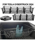 Three Pocket Trunk Cargo Net Made For Tesla Cybertruck 2024 Plus black mesh organizer holding bags in truck bed.