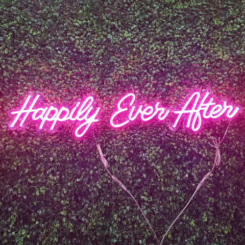 Pink Happily Ever After Neon Sign Wall Art Hangin Neon Light For Party Vibes Wedding Hashtag Decor Kid Bedroom Bar Home 12V DC Power Adapter Included For Easy Setup displayed on leafy background