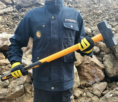 Person holding 10 Pound Sledge Hammer for Heavy Duty Demolition with 35 Inch Fiberglass Handle, Overstrike Protection