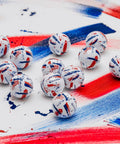 SpeedSoft Ink USA Dozen Soft Golf Balls With Ultra Low Compression PWRCORE Technology displayed on painted surface