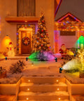 Festive scene with 8 Pack Smart RGBW Outdoor Landscape Lights With IP65 Waterproof, Low Voltage, App And Remote Control, 16 Million Colors.