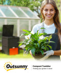 Woman holding plant in garden with Backyard Garden Compost Bin 80 Gallon Large Capacity Outdoor Composter in background