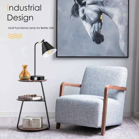 Must Have Dimmable Desk Lamp With 2 USB Ports And AC Outlet beside a gray armchair in a modern living room setting.