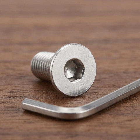 10 Piece Stainless Steel M8x60mm Full Thread Flat Head Screws With Hex Socket on a wooden surface