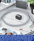 Half Inch Flexible Steel Electrical Conduit Kit With Four Couplings, Two Elbows And Seven Straps, 25 Feet Long on a desk
