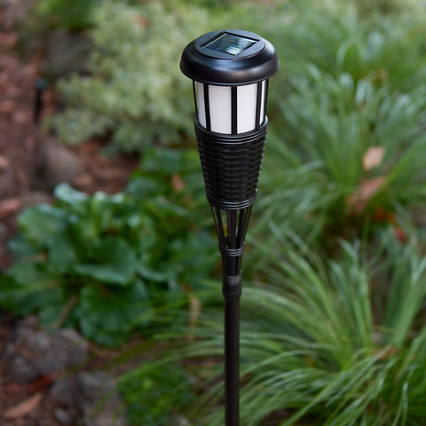 4 Pack Solar Powered Flickering Flame Outdoor Island Torches With Realistic Dancing Flame LED in garden setting
