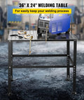 Heavy Duty Steel Welding Table And Workbench 36 By 24 Inches with welding machine and clamps in workshop setting.