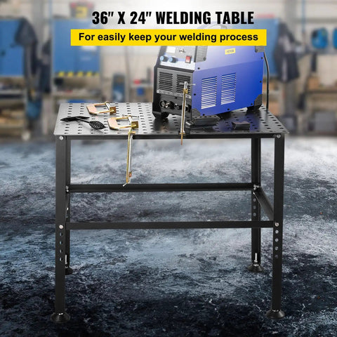 Heavy Duty Steel Welding Table And Workbench 36 By 24 Inches with welding machine and clamps in workshop setting.