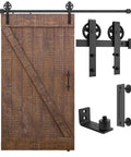 Built Like A Tank 7 Foot Sliding Barn Door Hardware Kit Featuring Heavy Duty Steel Tracks, Black Powder Coated Finish, No Sweat Setup, Handles Indoor Doors Up To 220 Pounds And 42 Inches Wide - showing assembled barn door with track and hardware.