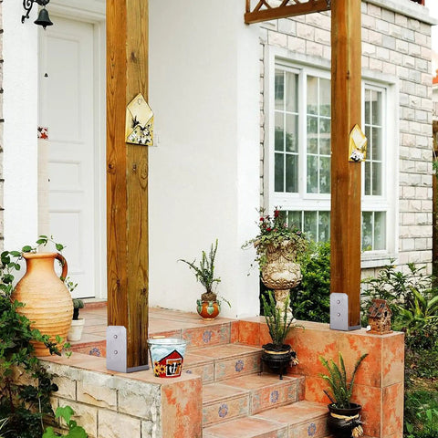 Front porch with 2 Pack 4x4 Post Base Adjustable Stainless Steel Anchor For Concrete Decks And Railings supporting wooden posts.