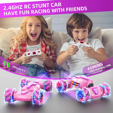 Kids playing with 2.4GHz Gesture Sensing RC Stunt Car With Hand Control And Remote, featuring pink lights and 360° rotation.