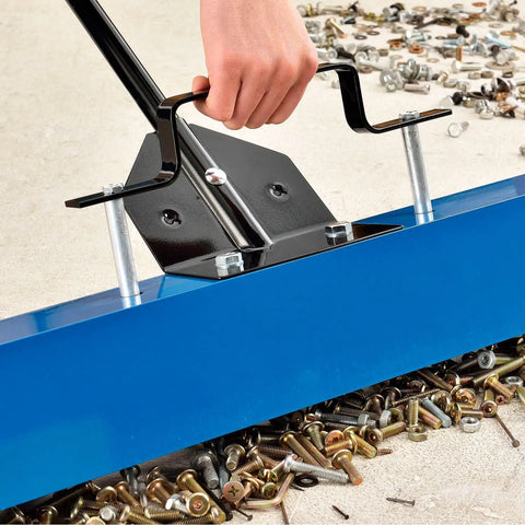 Heavy Duty Magnetic Floor Sweeper With Thirty Six Inch Wide Cleaning Path and Smooth As Butter Rubber Wheels maneuvering over metal debris.