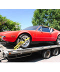 Heavy Duty Car Tie Down Straps For Trailers 2 Inch By 12 Foot, 10000 Lbs Break Strength securing red car on trailer