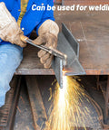 Stainless steel flat bar being welded by a worker; brushed finish on metal workbench.