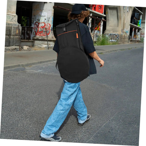 Person walking with Premium Drum Pad Storage Bag Featuring Slick Waterproof Fabric Cover And Smart Mesh Accessory Organizer Pouch For Snare Stand Gear Gig Ready Hella Durable Travel Case.
