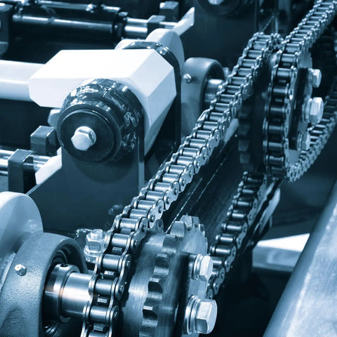 Hella Tough Carbon Steel Idler Sprocket 17 Tooth 9mm ID Built For ISO 04C Chains installed on a conveyor system.