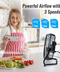 Woman in kitchen near 9 Inch Floor Fan With 3 Speed Settings, Portable Metal Design, Quiet Operation